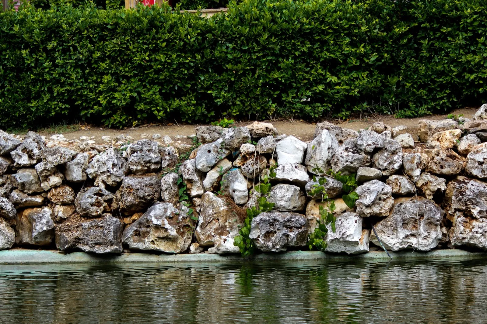 Natural stone retaining wall built into a terraced Ladue-area landscape