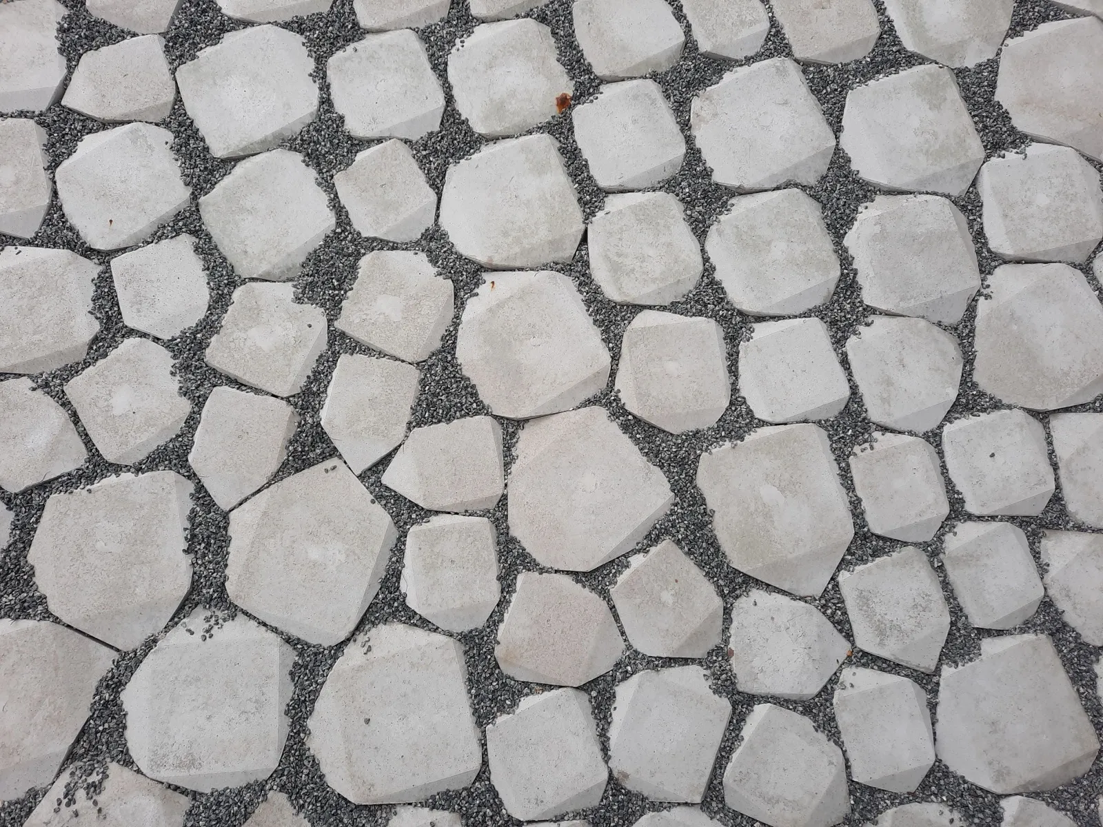 Stone pathway comparing natural stone materials in a landscaped garden